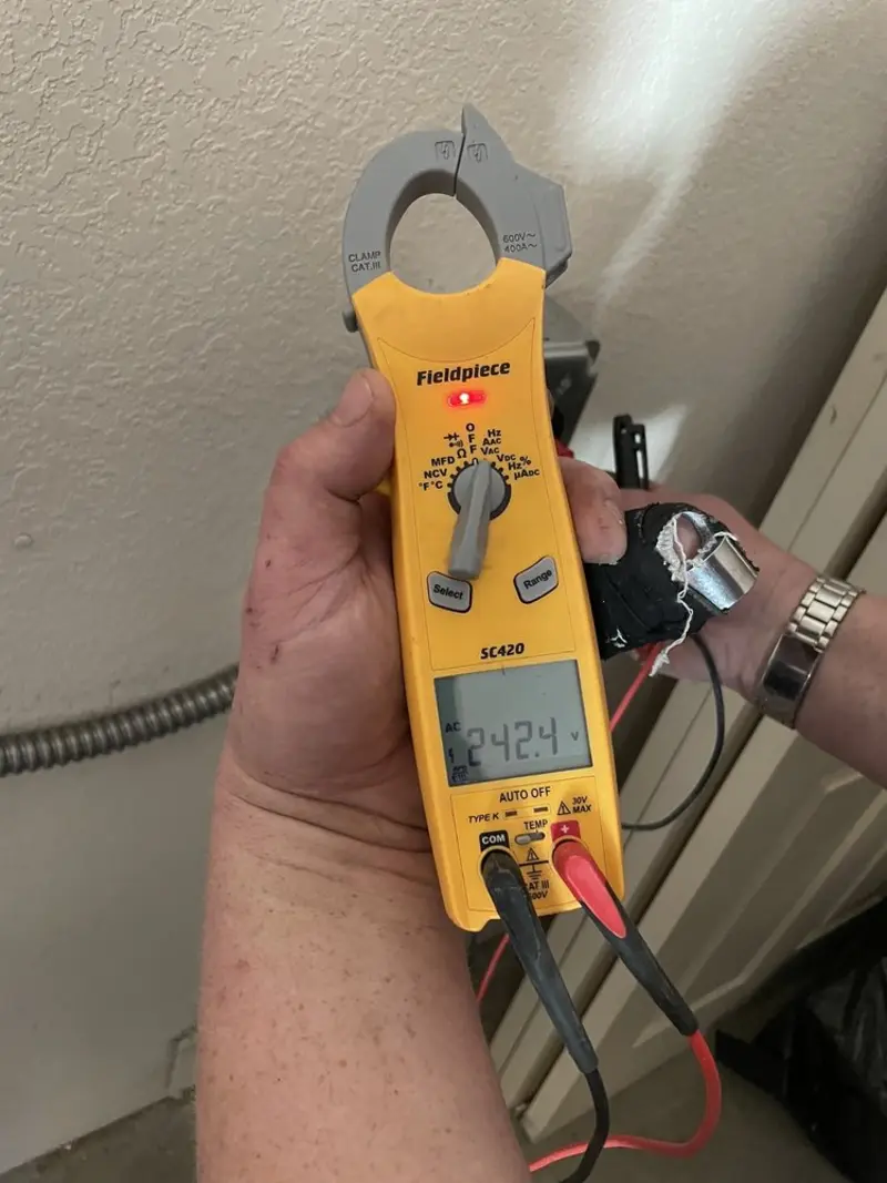 Voltage testing with clamp meter during Generator Installation in South Elgin